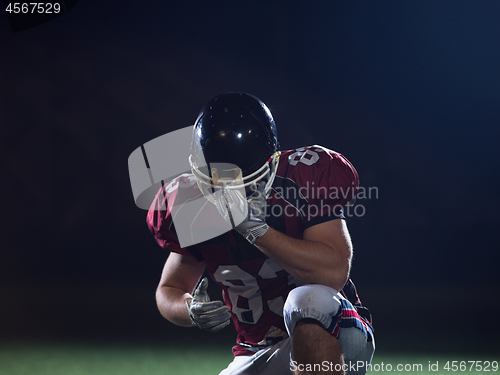 Image of portrait of young confident American football player