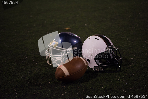 Image of american football and helmets