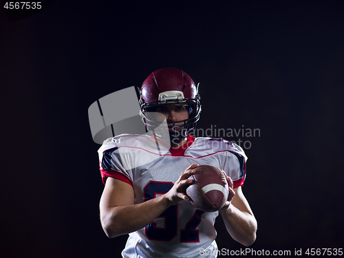 Image of american football player throwing rugby ball