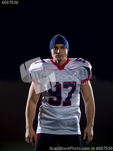 Image of portrait of young confident American football player