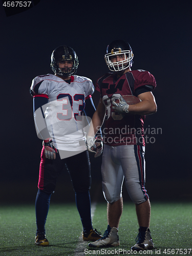 Image of portrait of confident American football players