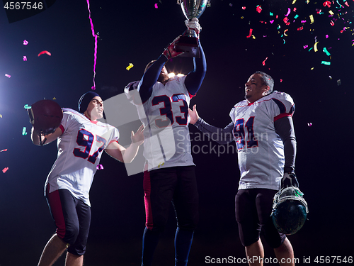 Image of american football team celebrating victory