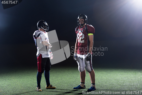 Image of portrait of confident American football players