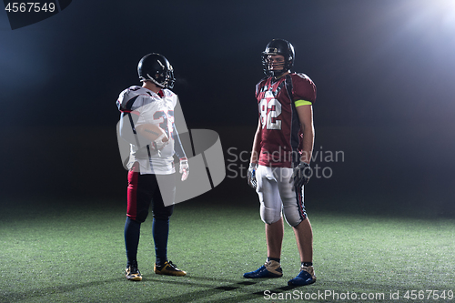 Image of portrait of confident American football players