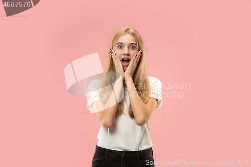 Image of Beautiful woman looking suprised isolated on pink