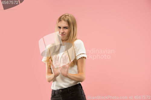 Image of Let me think. Doubtful pensive woman with thoughtful expression making choice against pink background