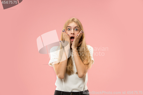 Image of Beautiful woman looking suprised isolated on pink