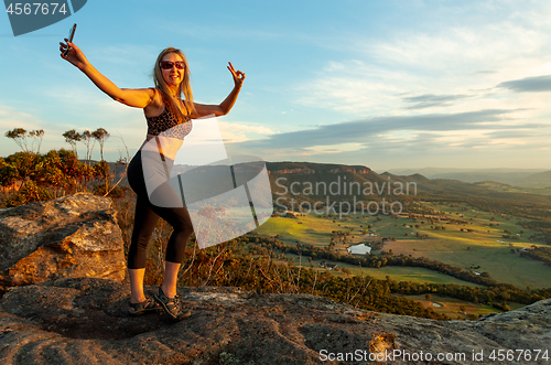 Image of The selfie generation a tourist at lookout taking photo