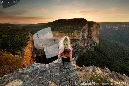 Image of Sitting on rock watching the sunset mountain views