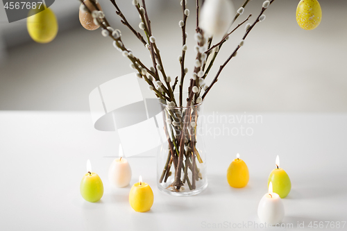 Image of pussy willow branches decorated by easter eggs