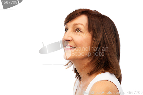 Image of portrait of smiling senior woman over white