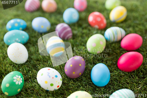 Image of colored easter eggs on artificial grass