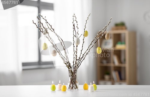 Image of pussy willow branches decorated by easter eggs