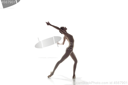 Image of Ballerina. Young graceful female ballet dancer dancing isolated on white. Beauty of classic ballet.