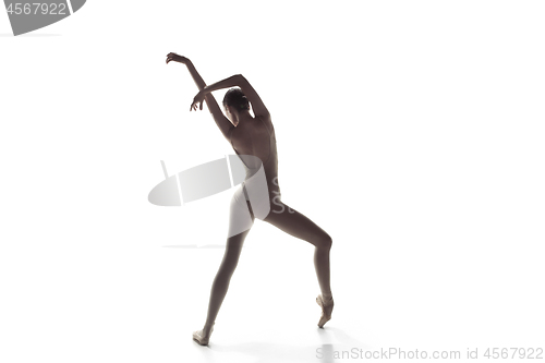 Image of Ballerina. Young graceful female ballet dancer dancing isolated on white. Beauty of classic ballet.