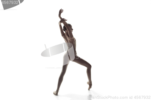 Image of Ballerina. Young graceful female ballet dancer dancing isolated on white. Beauty of classic ballet.