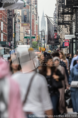 Image of New York, NY, USA - May 17, 2018: Crowds of people walking sidewalk of Broadway avenue in Soho of Midtown Manhattan on may 17th, 2018 in New York City, USA.