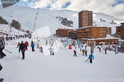 Image of Skiing slopes, with many people