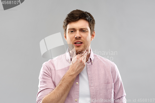 Image of man suffering from sore throat