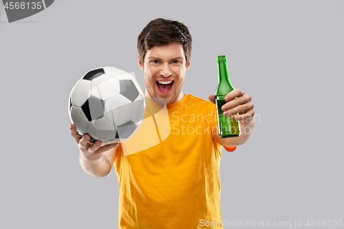 Image of man or football fan with soccer ball and beer