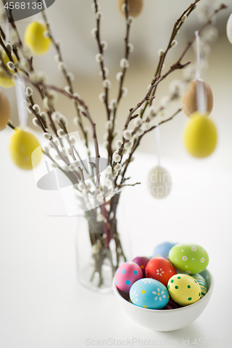 Image of close up of pussy willow branches and easter eggs