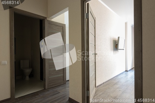 Image of Corridor in a small apartment, open doors