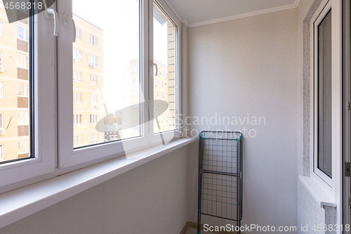 Image of Small glazed balcony in the apartment of a residential building