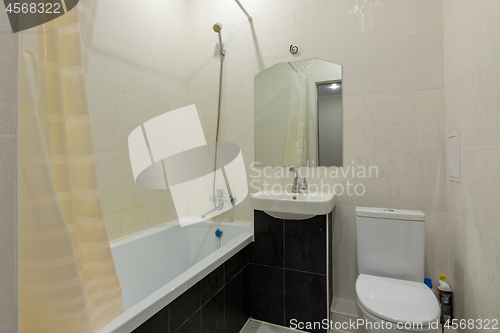 Image of Interior of a small combined bathroom and toilet