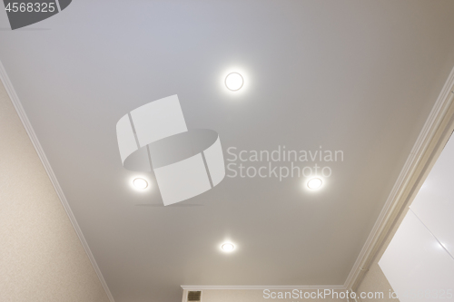 Image of Ceiling in the kitchen, with four spotlights installed and turned on