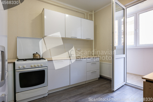 Image of Fragment of the interior of a small kitchen with access to the balcony