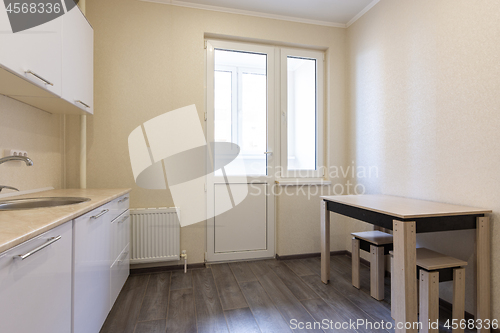 Image of Kitchen interior, view from the closed balcony door