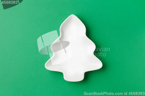 Image of empty white bowl on green background