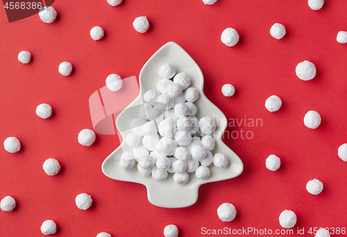 Image of cranberries covered with powdered sugar on fir shape plate