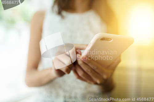 Image of Woman using mobile phone