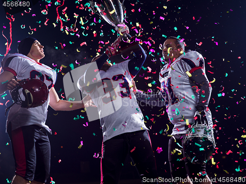 Image of american football team celebrating victory