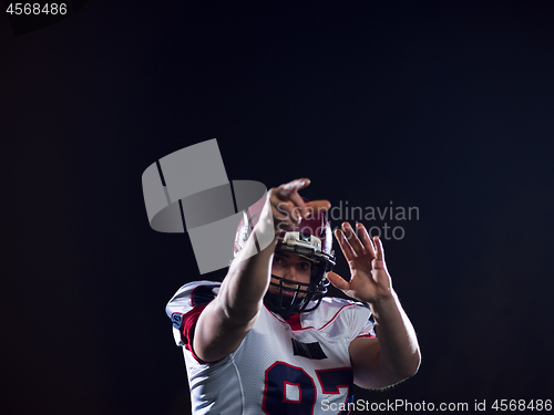 Image of american football player throwing rugby ball