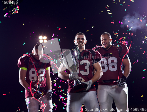 Image of american football team celebrating victory