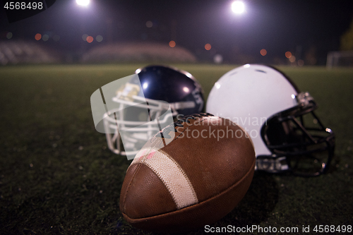 Image of american football and helmets