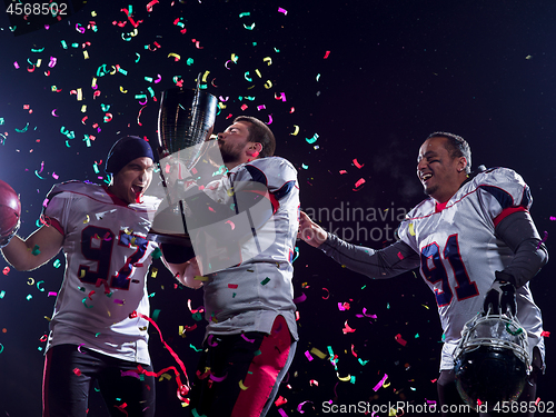 Image of american football team celebrating victory