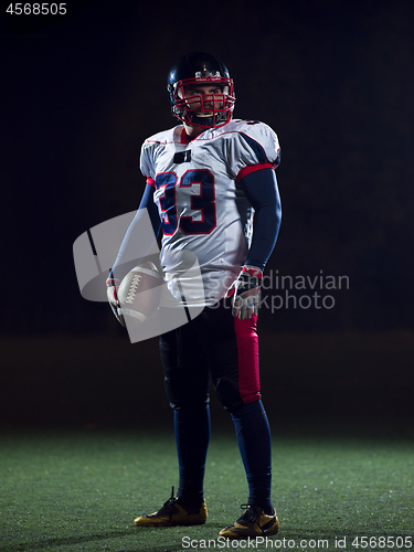 Image of portrait of confident American football player