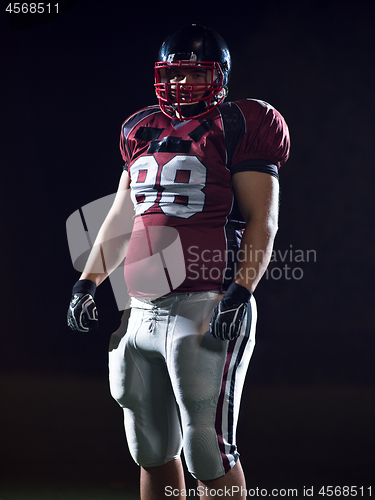 Image of portrait of young confident American football player