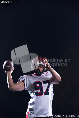 Image of american football player throwing rugby ball