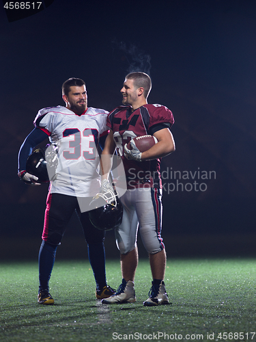 Image of portrait of confident American football players