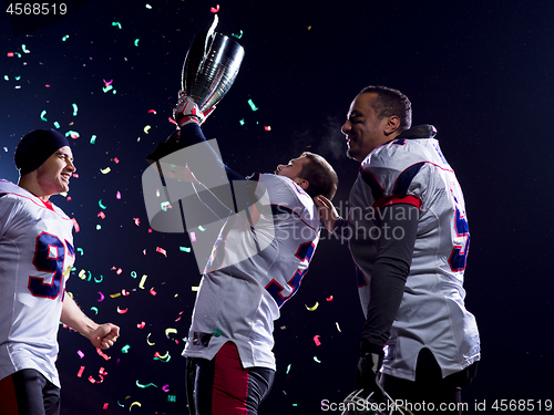 Image of american football team celebrating victory