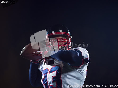 Image of american football player throwing rugby ball