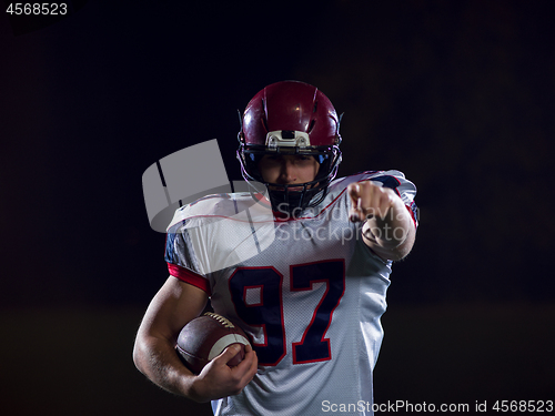 Image of portrait of confident American football player