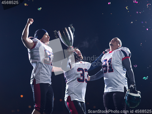 Image of american football team celebrating victory