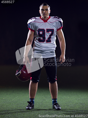 Image of portrait of young confident American football player