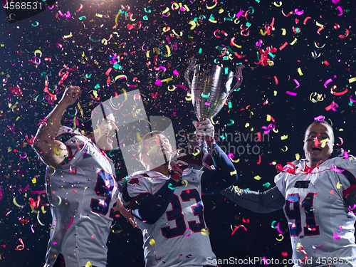 Image of american football team celebrating victory