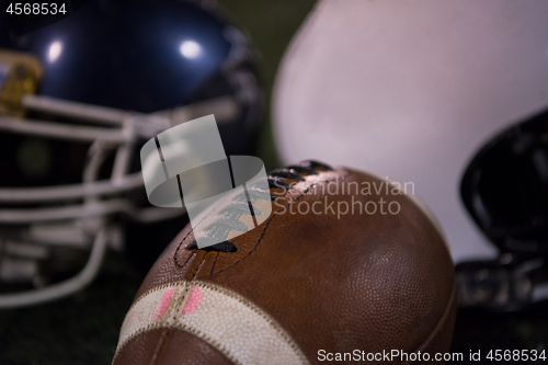 Image of american football and helmets